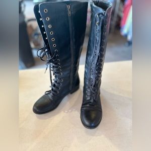 Rampage knee high lace up boots with inside zippers.